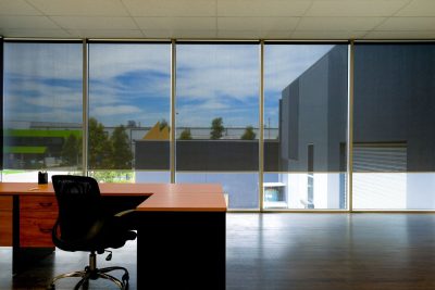 The automated roller blinds in modern office